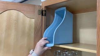 Put a Dollar Store book bin in your kitchen cabinet this is BRILLIANT!