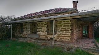 Forgotten farm house with old items and old machines