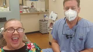 Dr. Lasorsa talks with his patient Beverly about her experience with Mini Dental Implants