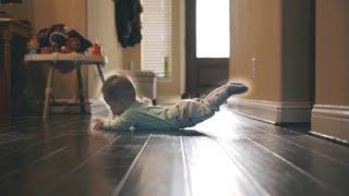 Baby crawling across hallway