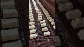 Putting the finishing touch on our Dark Almond Nougat for #NationalNougatDay.  #howitsmade