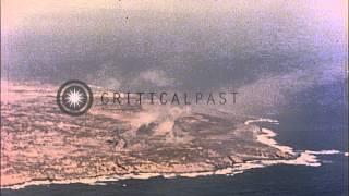 Aerial views of Mount Suribachi's volcano crater, shoreline and airfield at Iwo J...HD Stock Footage