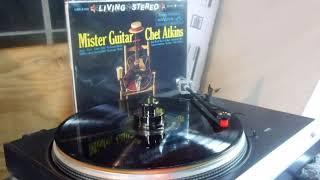 Playing a (1959)  Chet Atkins, Vinyl Record.