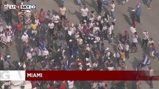 Miami SOS Cuba protesters start to gather around stage on Calle Ocho