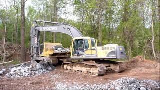Volvo 290 Excavator Loading Komatsu Track Truck