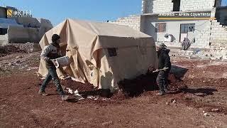 Volunteers install tents for those affected in Afrin's Jindires