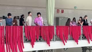 Playing the rubber tubes in the Mercado do Bolhâo in Porto