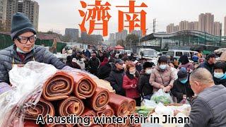 A traditional winter fair in northern China is crowded with people