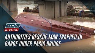 Authorities rescue man trapped in barge under Pasig bridge | ANC