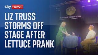 Liz Truss storms off stage after lettuce banner prank