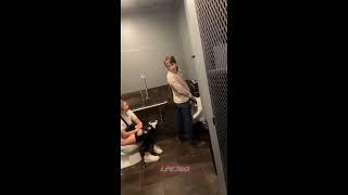 Girl uses toilet and talks in mens room