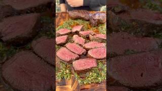 Picanha steak in a chimichurri board sauce