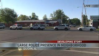 Large police presence on scene in Du Quoin, person barricaded in building with gun