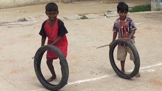 VILLAGE FUNNY VIDEO Waste tire game at village / Indian village kids Playing In Street/Village life