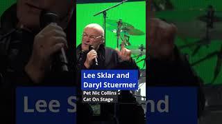 Lee Sklar and Daryl Stuermer pet Nic Collins cat on stage ⬘ Sept 24 2019 ⬘ Houston, TX