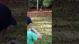 shooting my Bb gun In my yard and having some fun