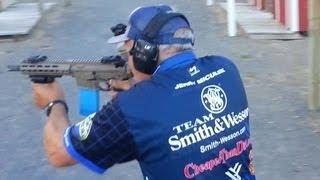 Champion shooter Jerry Miculek shooting full auto M4 rifle- Crimson Trace Midnight 3-gun