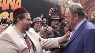 The moment John Rhys-Davies met Sallah Cosplayer Indiana Jones Nerd At Dial of Destiny Red Carpet