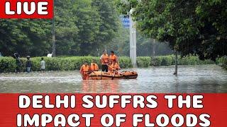 DELHI ALMOST SUBMERGED AS RAINS RAGE ON