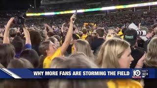 Storming The Field: A look at why more college football fans are celebrating on the field after b...