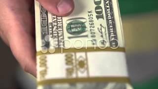 Child holding ten thousand dollar stack of money - stock video