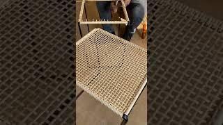 How rattan mesh weaving is woven on wrought frames.