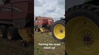 New Holland big square baler getting the straw baled up! #wheat #bales #newholland