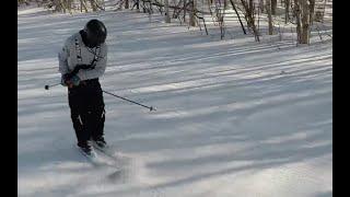 How to do sliding 360's down the hill on skis