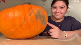 carving my face onto a pumpkin