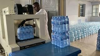 Bottled water production process at a portable bottled water factory in Nigeria