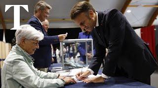 Macron votes in legislative run-off