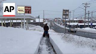 Heavy snow blankets parts of the US during busy holiday travel weekend