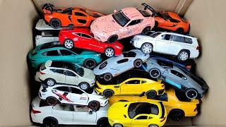 Box Full of Model Cars Rolls-Royce Cullinan, Lykan Hypersport, Porsche Taycan, McLaren Senna, Jeep