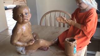 Sister Covers Baby Brother in Peanut Butter