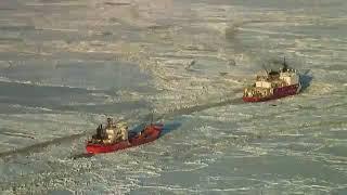 Nation's only operating Polar ice breaker, CGC Healy, breaks ice for Nome bound tanker