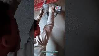 Smoothing Concrete Wall Plaster with Portable Rotary Tool