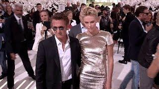 CHARLIZE THERON and SEAN PENN in LOVE at Dior Fashion Show in Paris - Photocall and Front Row