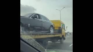 A Badly Damaged ₦200m Rolls-Royce Ghost Spotted Behind A Truck On The Nigerian Road