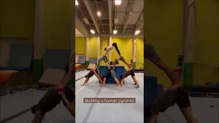 The process of building a human pyramid  #acrobatics #acrobats #fun #gym #gymnastics #acro