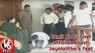 AIADMK Activists And TN Govt Officials Touch Jayalalitha's Feet After Grand Victory In Elections