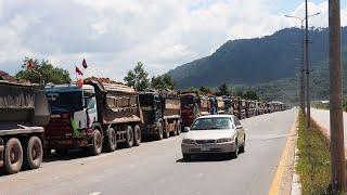 Huge Dump Truck Moving Dirt Stone Sea Side Reclamation Bulldozer Pushing Soil Stone Into The Sea