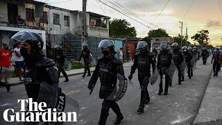 Cuban authorities crack down on protests as rallies spring up across US in support