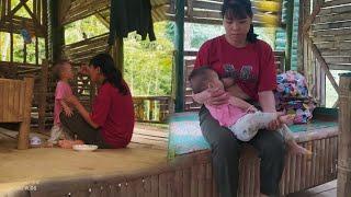 single mother,repairing water,digging drainage ditches for the house & cooking porridge for her baby