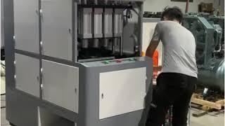 BG-2000A We are testing four cavities semi automatic pet bottle blow molding machine.