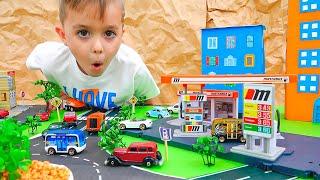 Vlad et Niki jouent avec des petites voitures et construisent Matchbox City