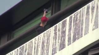 Justin Bieber waves to fans outside his hotel in Zurich