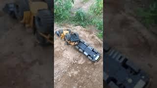 Dump Trucks Unloading Rock And Biggest Bulldozer b57