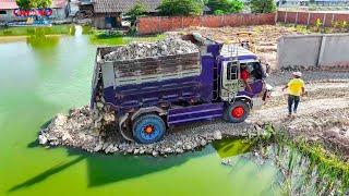 Wonderful showing Best technique skill Driver use Mini Dozer pushing Rock soil drop into water clear