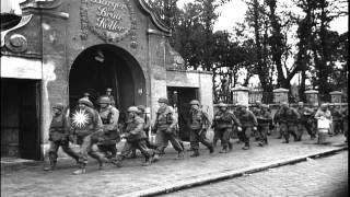 US Army soldiers of 42nd (Rainbow) Division march past Burger-Brau Keller HD Stock Footage