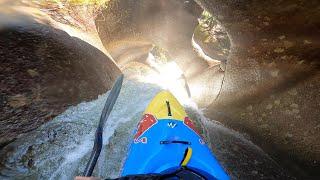 Kayaking through a crazy 50ft Tunnel Waterfall.
